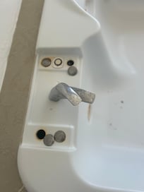 The hot tub faucet was loose and all around the faucet was disguising.