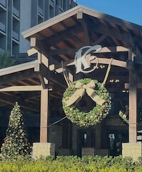 A wonderful wreath hanging outside with two other ones that lit up at night it was beautiful.