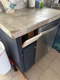 Broken cabinet the main cabinet was completely off the hinges.