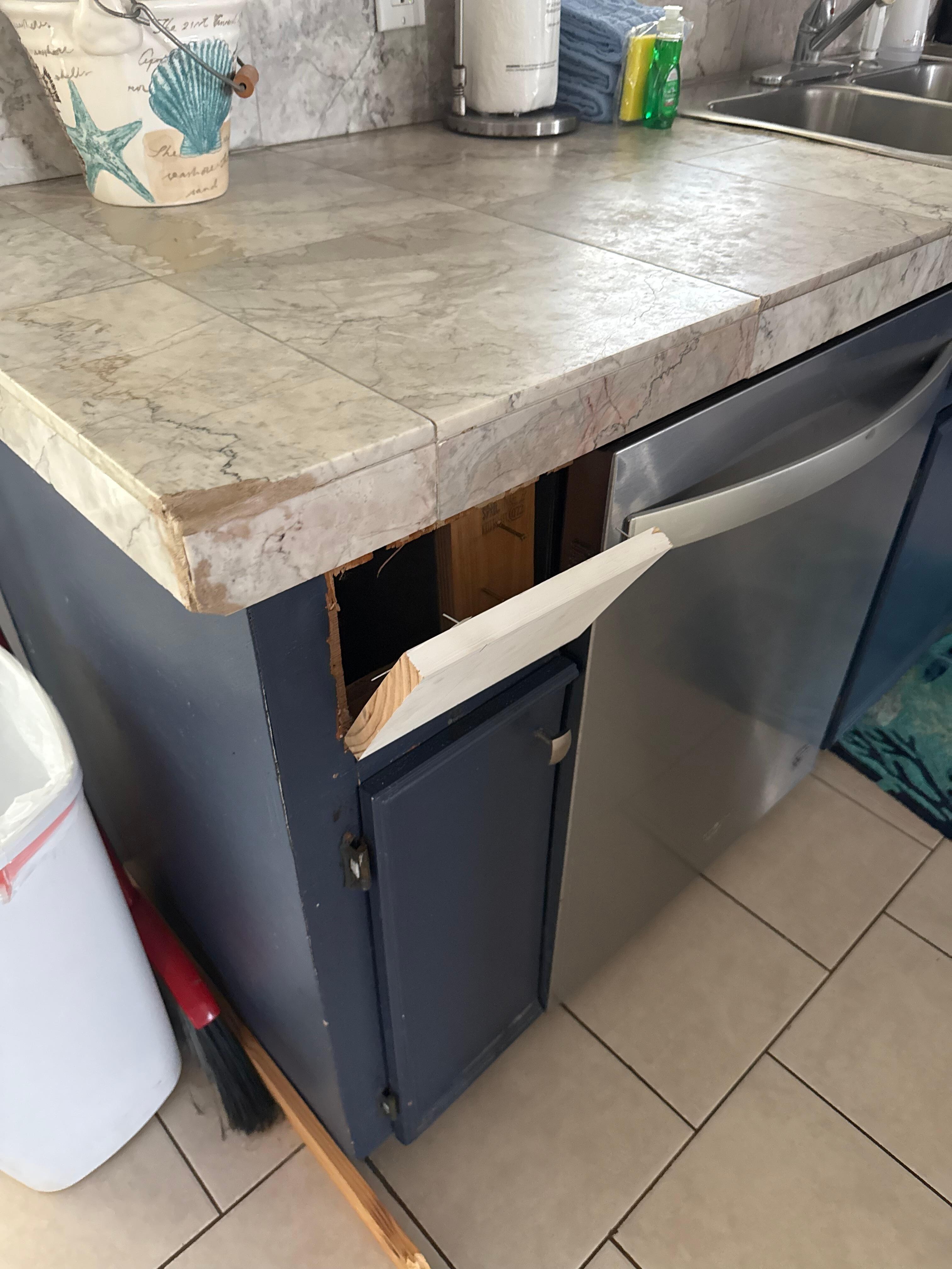 Broken cabinet the main cabinet was completely off the hinges.