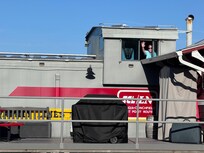 A wave to passing train from up in the cupela