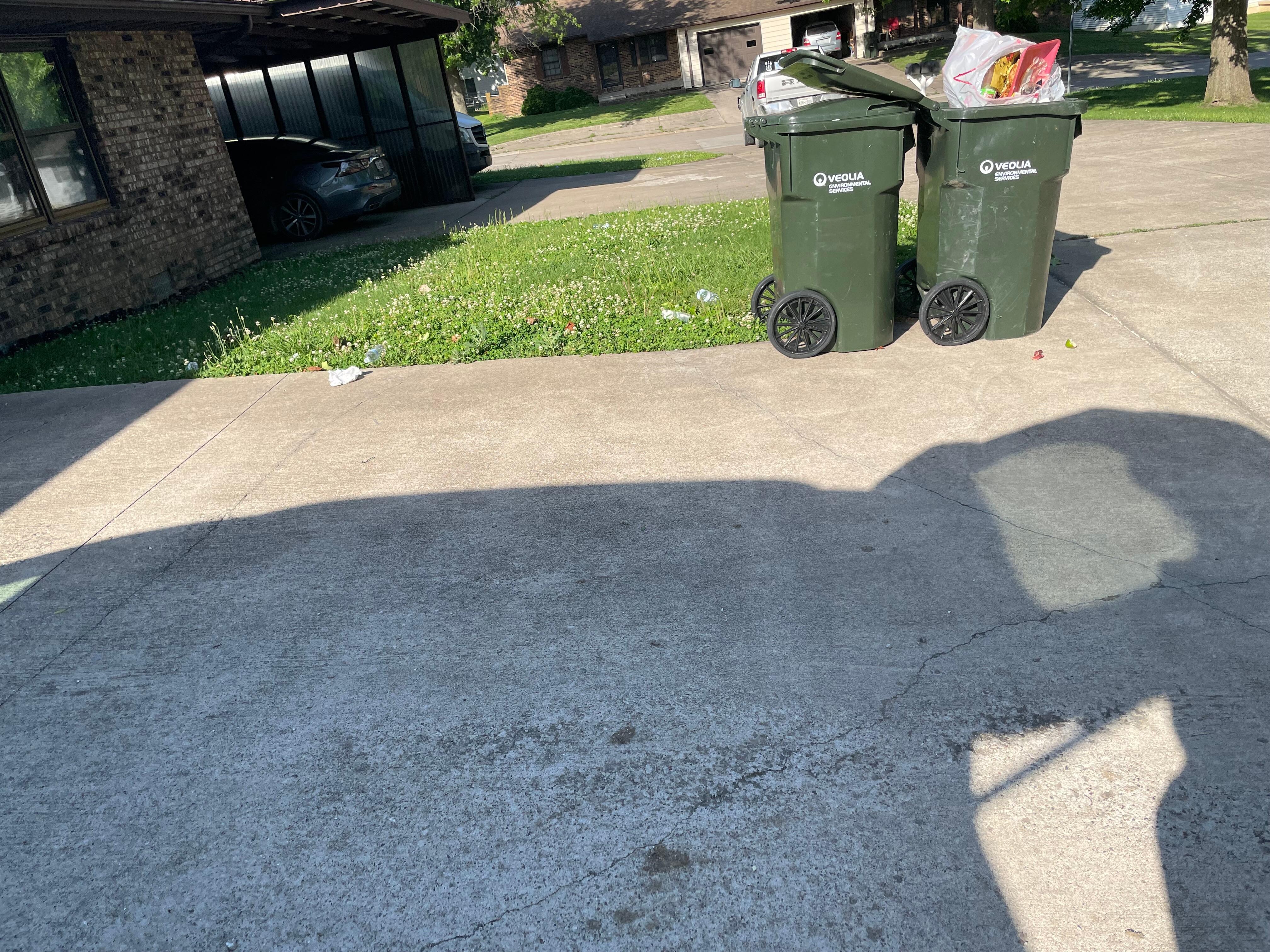 Dumpster in driveway to property.