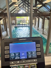 Gym over looking the pool/jacuzzi/sauna:steam room area