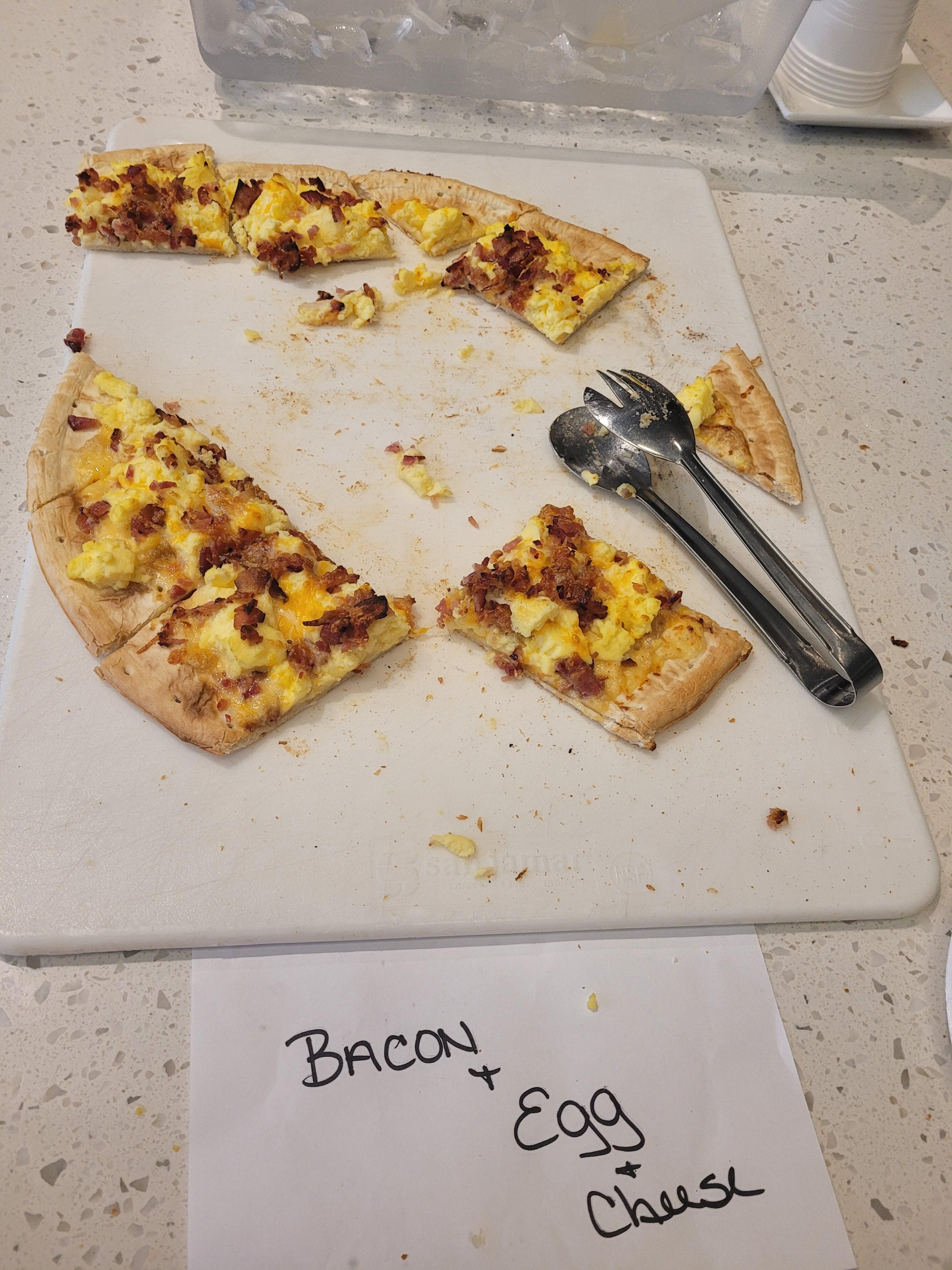 They had four varieties of pizza,  along with juice and fruit. 