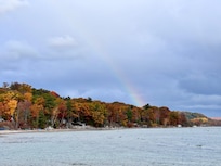 A rainy morning over the bay with some fall colors and a rainbow!