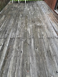 Splintered deck with boards loose. A bit dangerous to walk on.