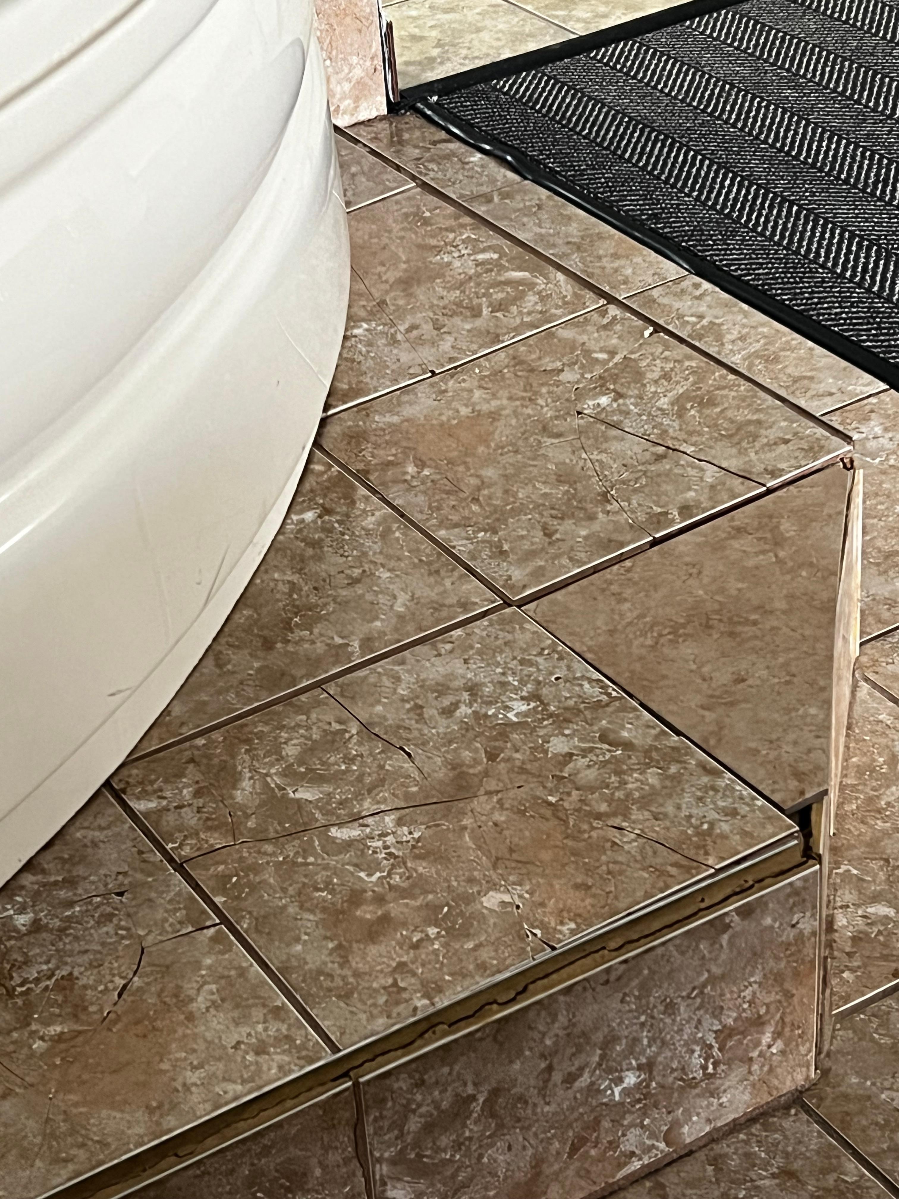 Broken tiles on jacuzzi platform.