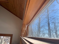 Spiderwebs never clean above sliding door