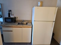 Old laud fridge. Broken inside. Cabinets are from the 60'