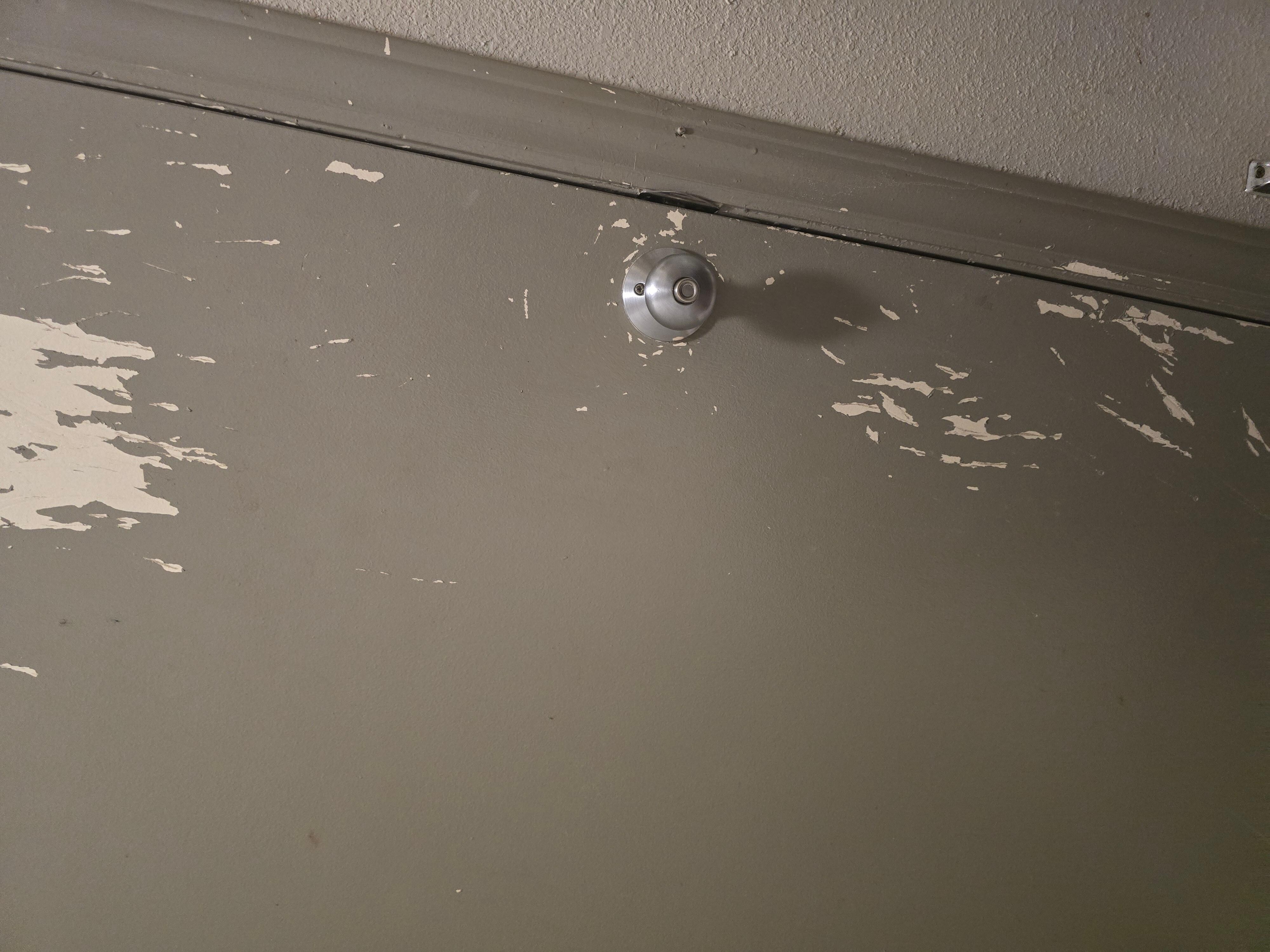 Peeling paint on door