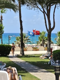 Private beach with plenty of umbrellas