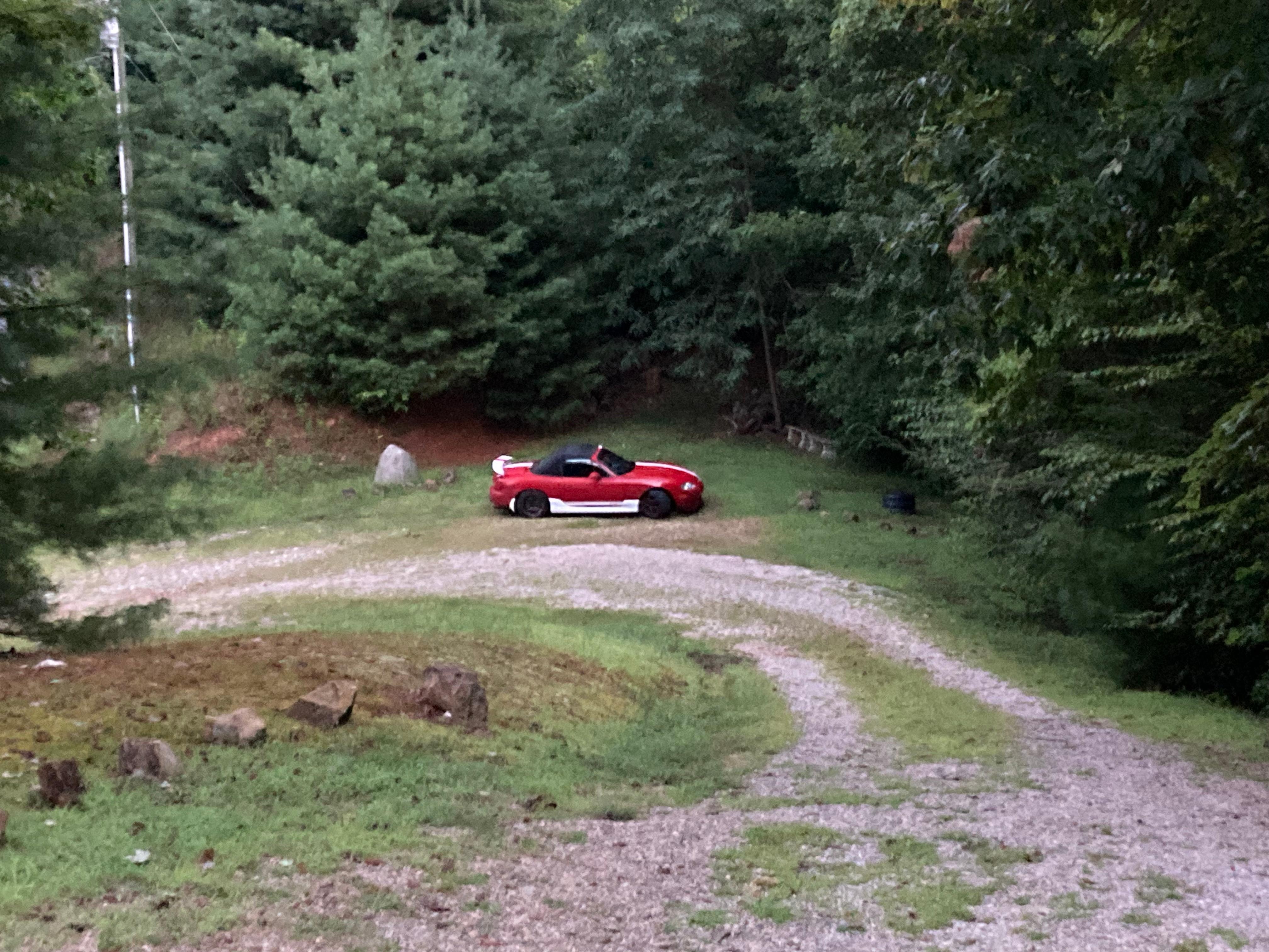 Lowered car at the bottom of the driveway.