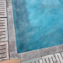 Dark black stuff at the bottom of pool.