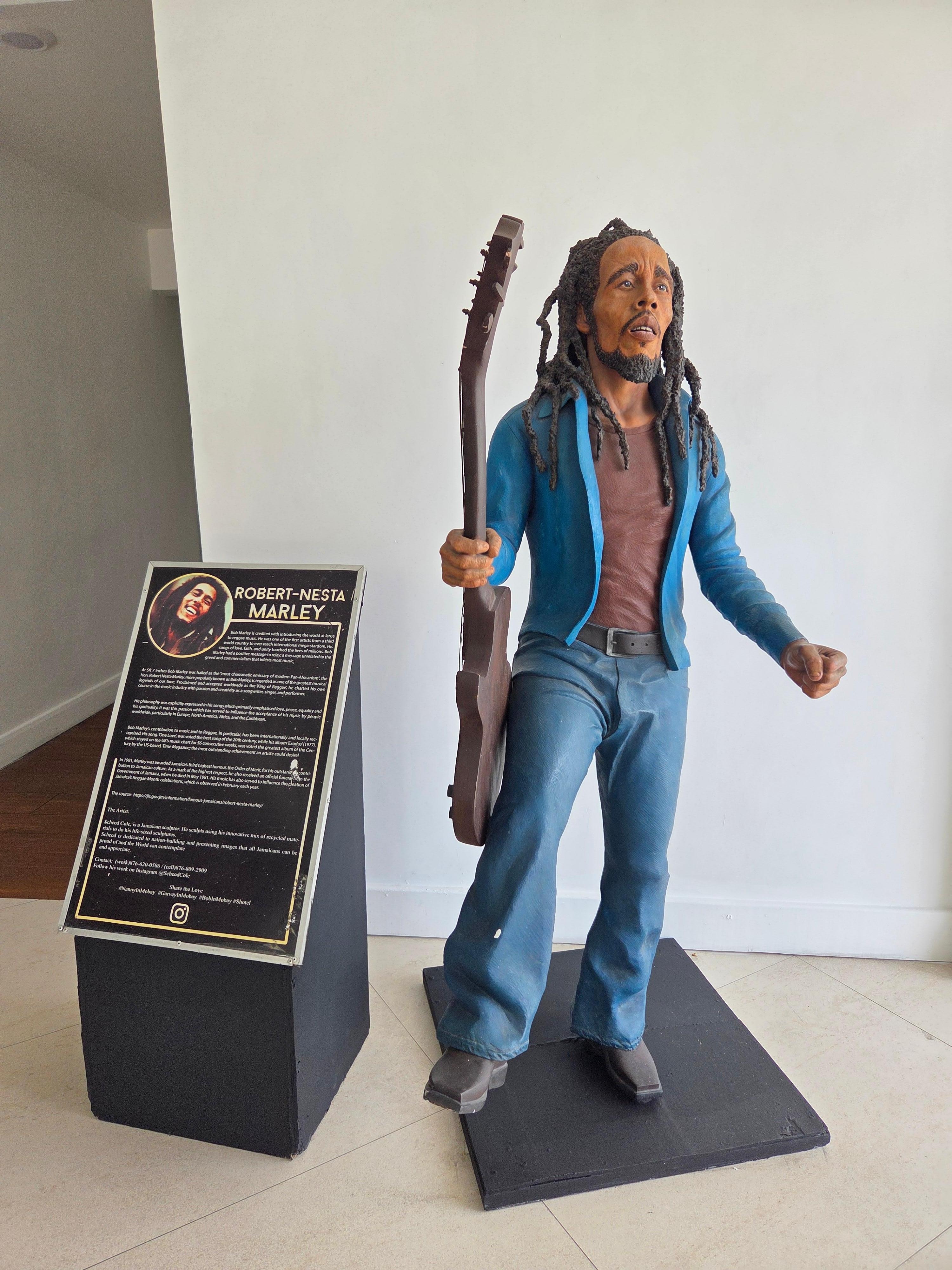 Bob Marley statue on one floor outside the elevator