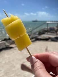 The staff comes around with frozen pineapple or mango popsicles in the afternoon. A full bar and menu is also available poolside!