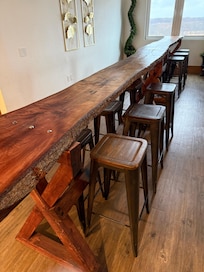 No chairs. Just hard stools.