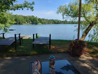 View from the patio with comfy outdoor furniture and quaint lighting.