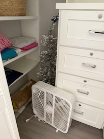 Additional closet filled with clutter