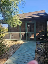Front of cottage(Cushing) Beautiful screened porch.