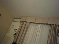 Ceiling damage and super old curtains that aren’t moveable