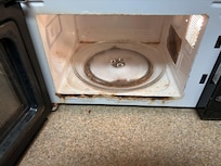 This is the burnt and dirty microwave we had in room when we arrived.