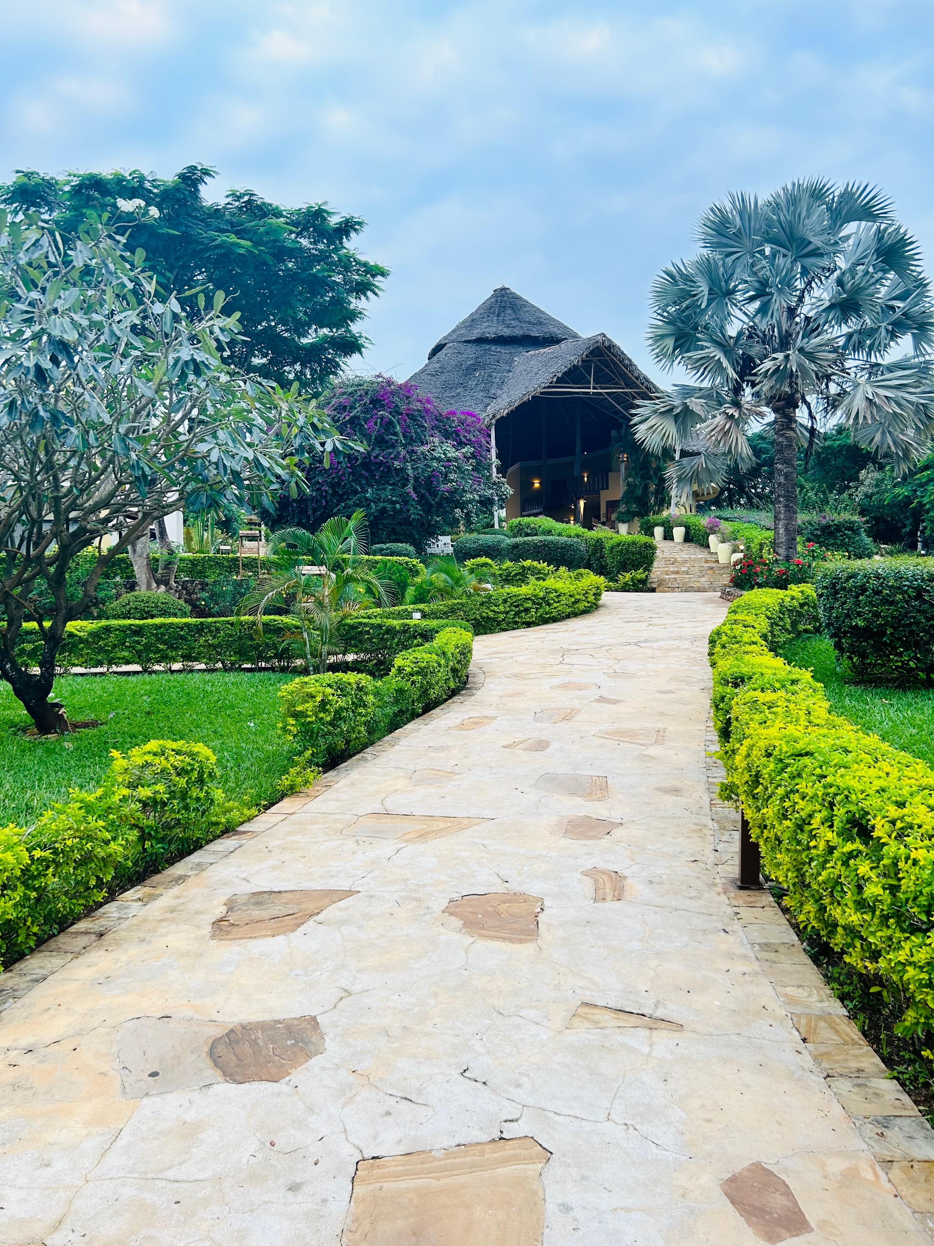 Gardens walking to room - building is the reception