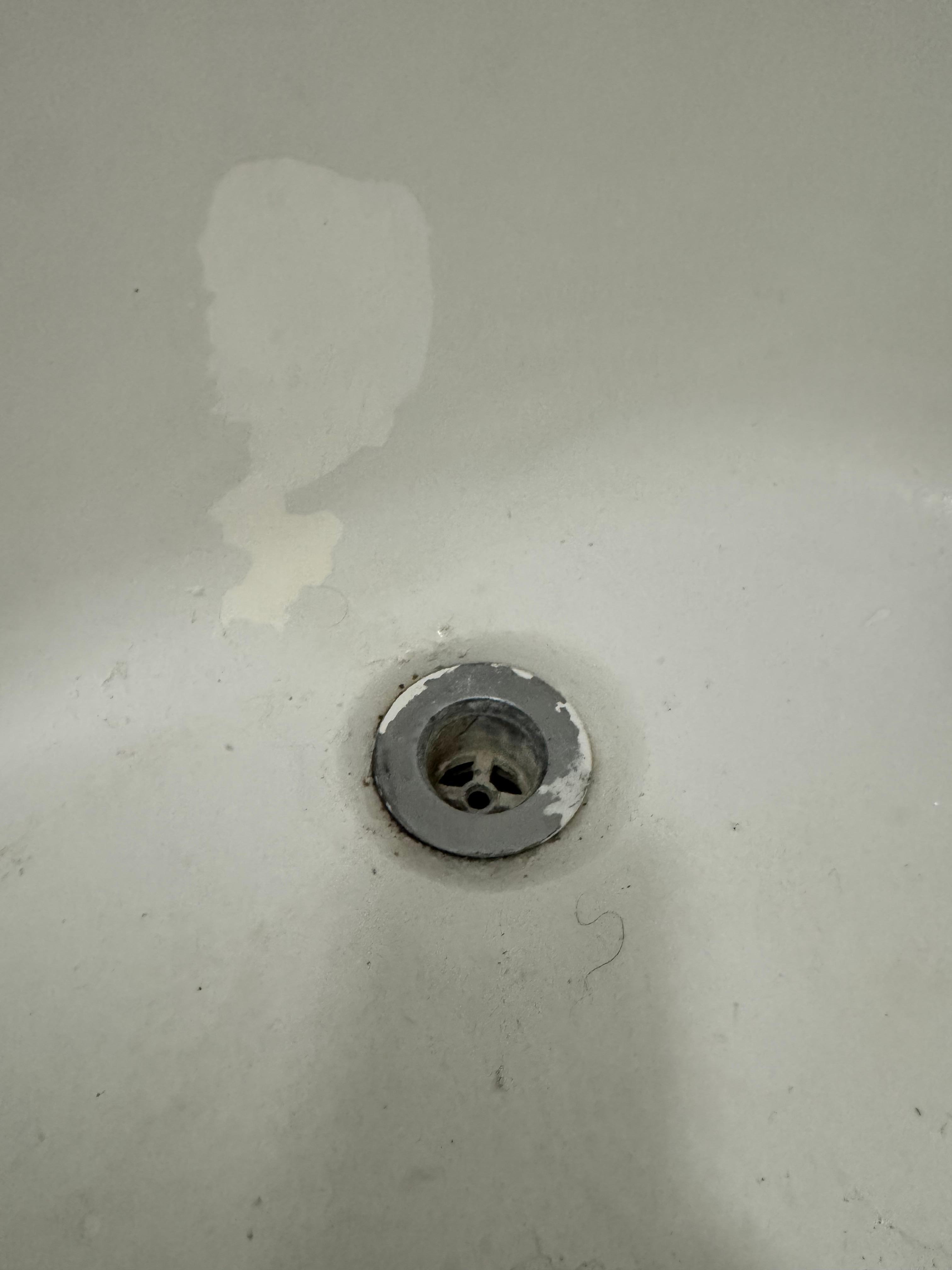 Dry paint on bath tub.