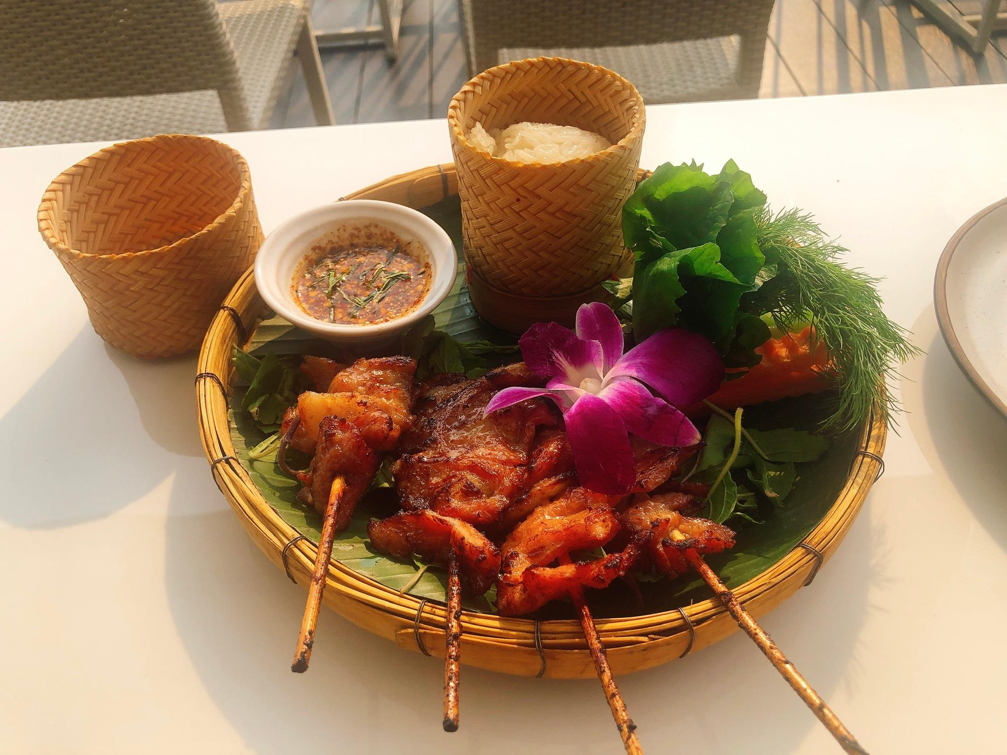 Marinated grilled pork with veggies, sticky rice, and house dip. I would eat this everyday. 