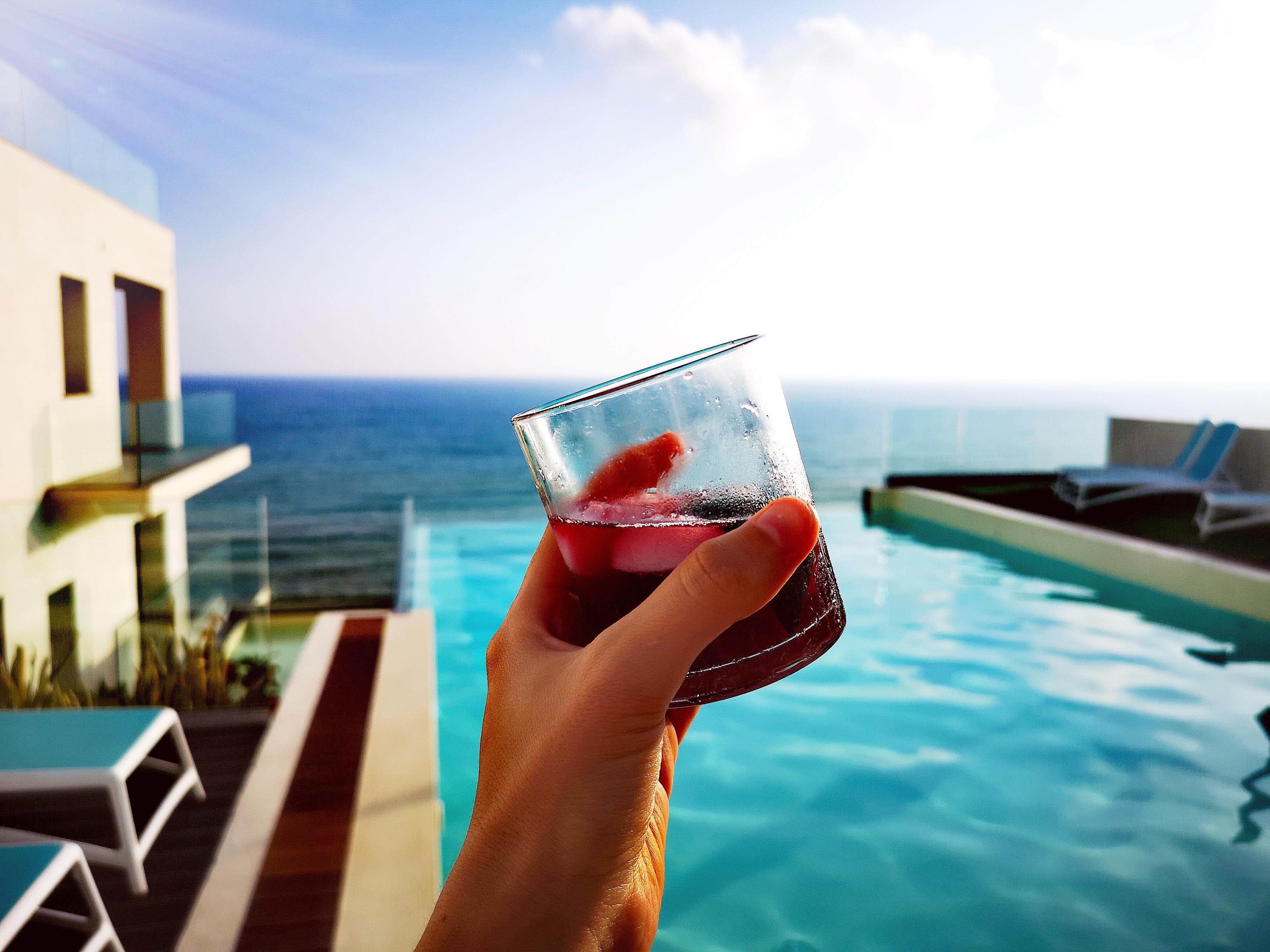 Aperitivo by the pool during golden hour 