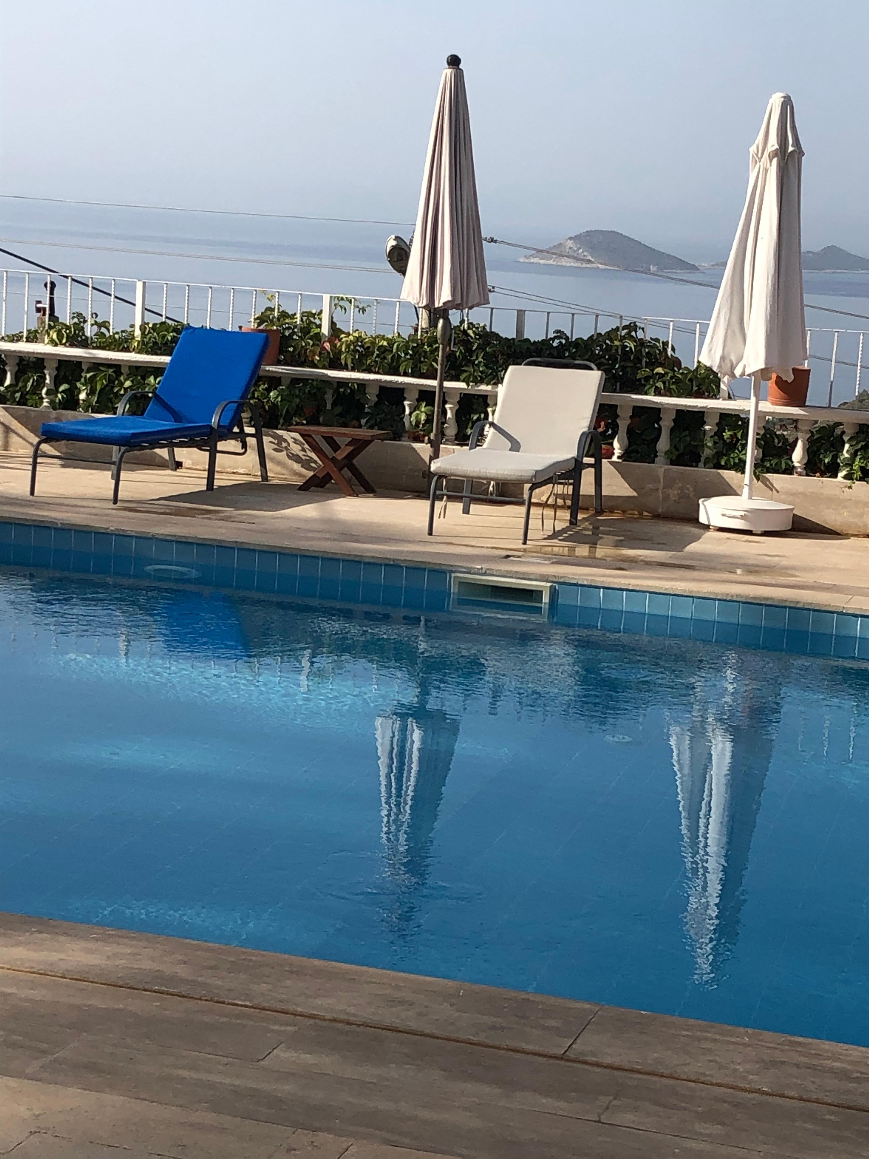 Daytime pool and sea view 