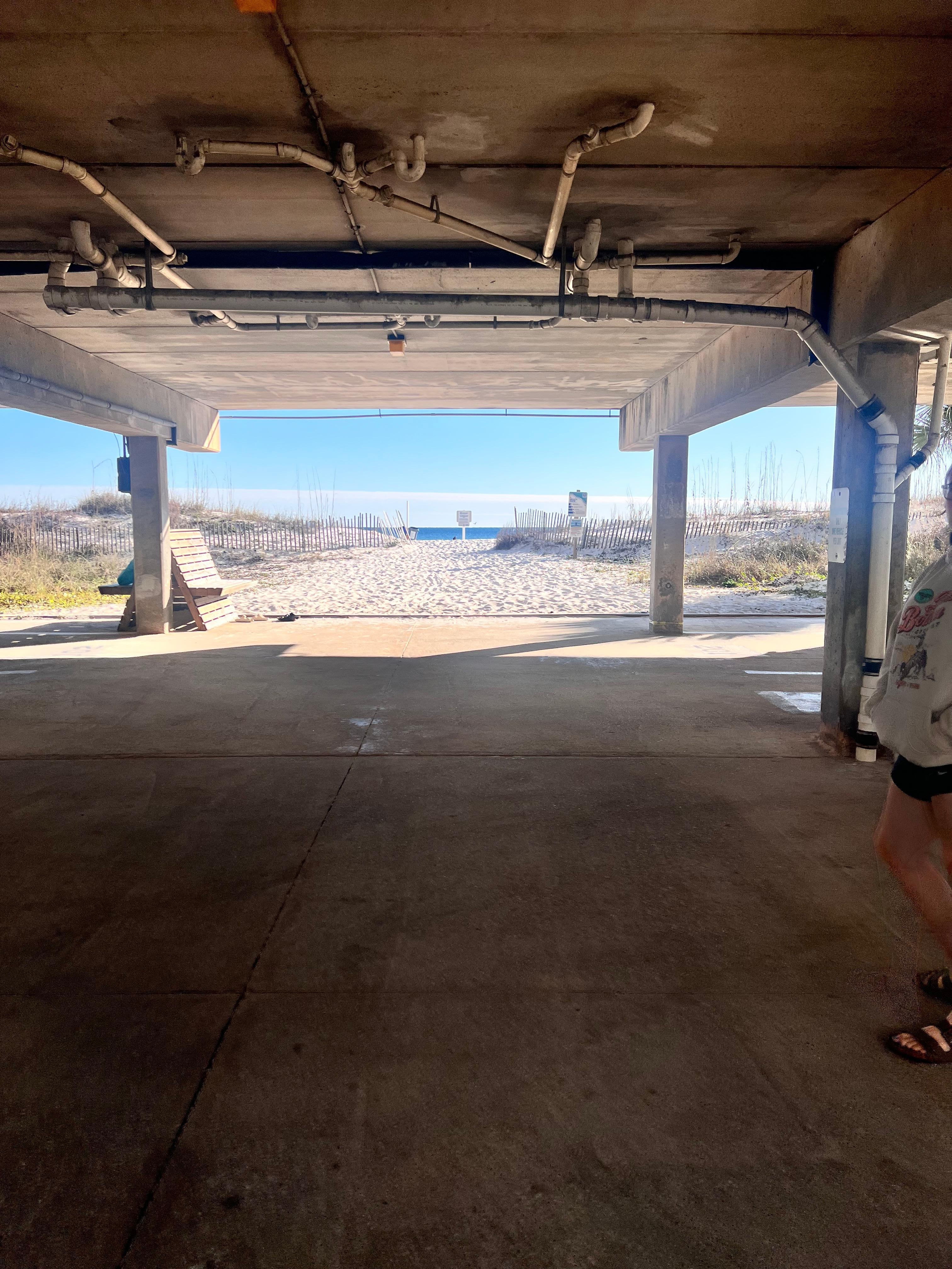 View from the parking under the unit. Literal steps from the beach. 