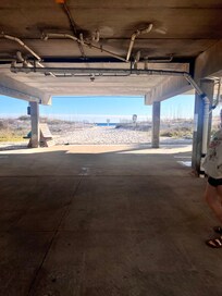 View from the parking under the unit. Literal steps from the beach.