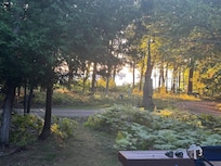 View of lake from cottage deck near sunset
