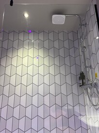Nice shower with waterfall shower head.