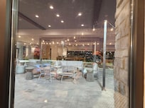 Out door seating area with grills .