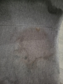 This is a chair that looks as if someone with diarrhea day on it.