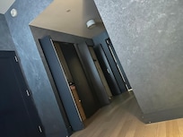 Bedroom which has many closet that lead to the bathroom