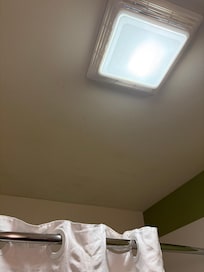 A photo of the mold on the ceiling of the bathroom.