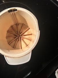 Stained original coffee machine after cleaning