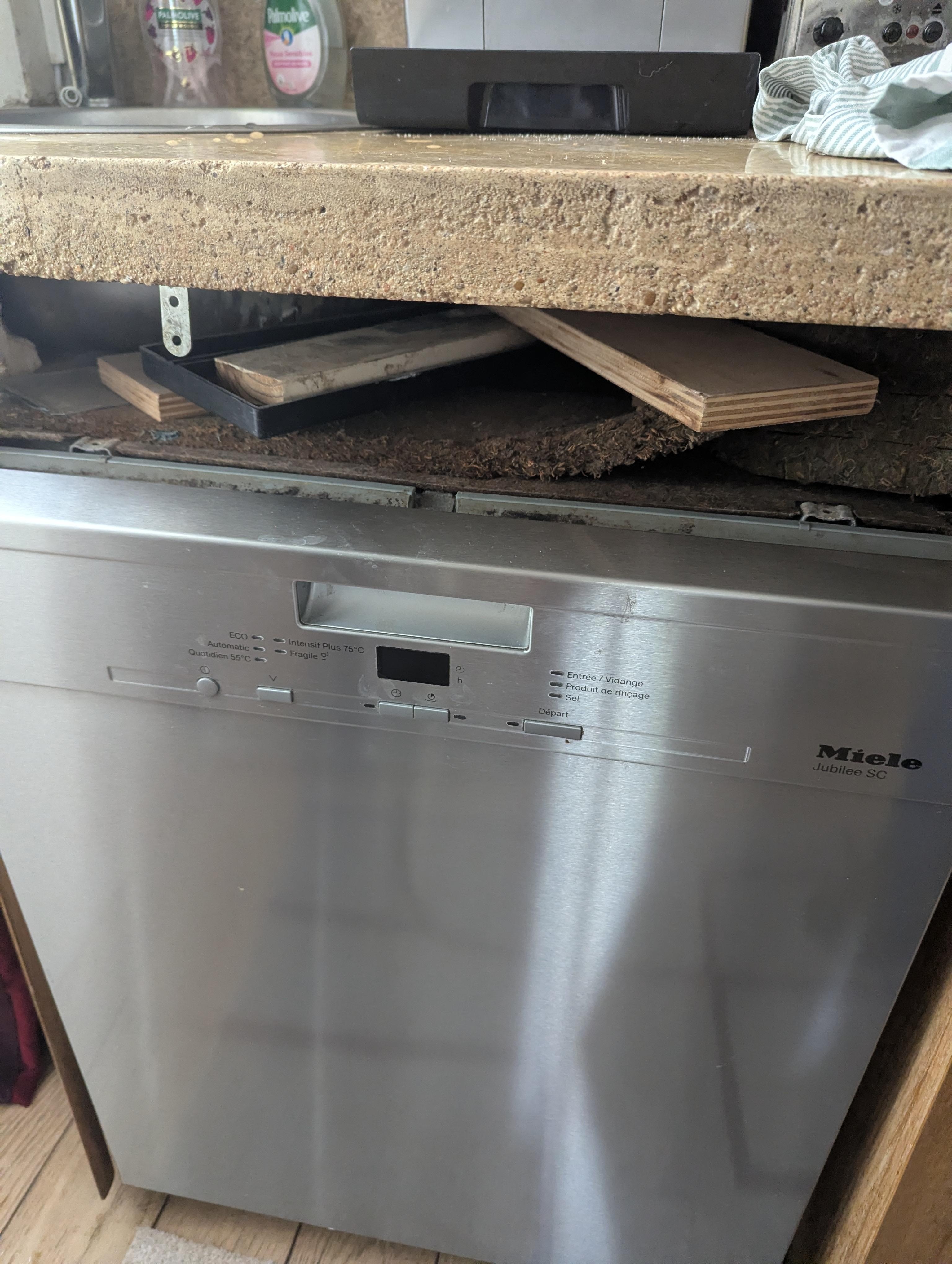 Dishwasher is crooked and filler above broken