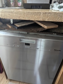 Dishwasher is crooked and filler above broken