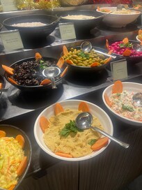 Hummus with dried top layer, served repeatedly for 3–4 days. Carrots around dishes were also dried and clearly several days old. Food was reused daily until I complained. Serious hygiene and food safety concern.