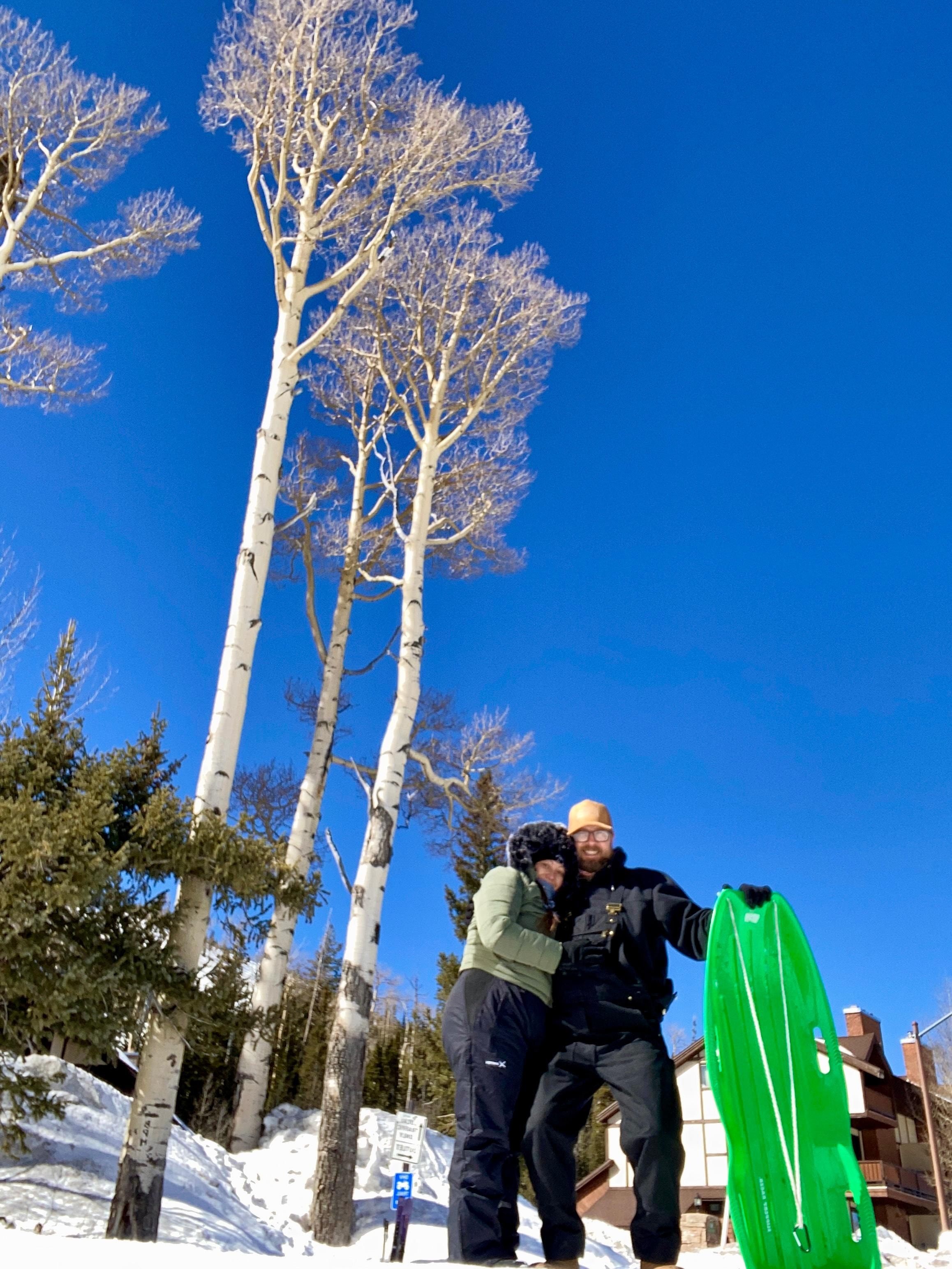 Fun sledding on hill of the pond 