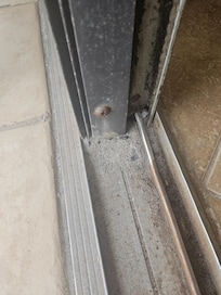 Broken patio track and full of black mold