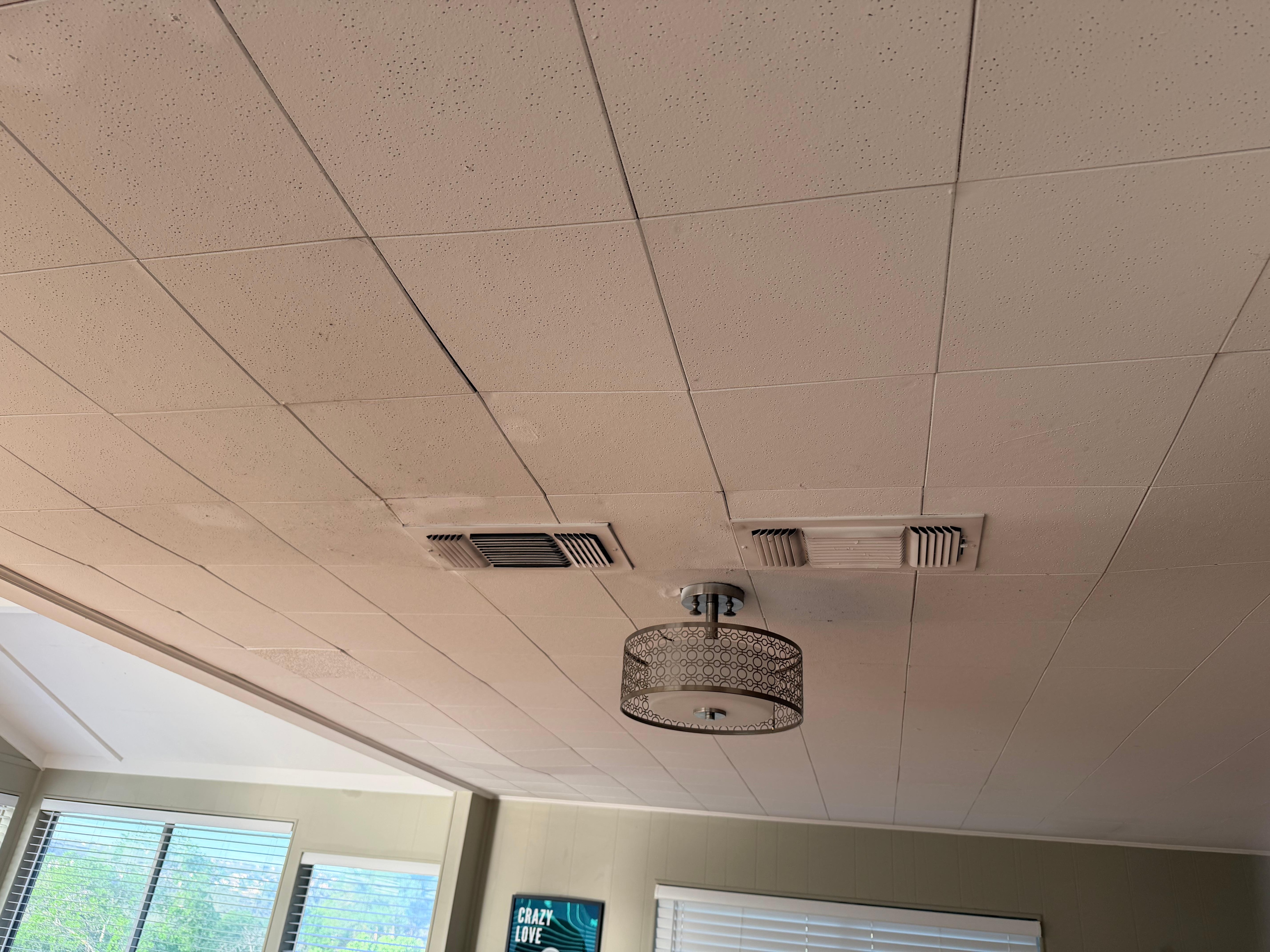 Discolored ceiling that sags around this light and vents