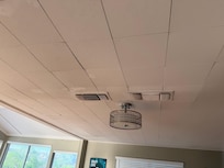 Discolored ceiling that sags around this light and vents