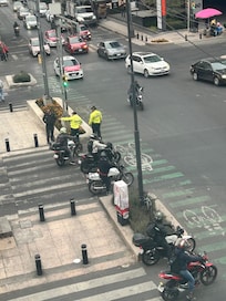 Early morning traffic, daily, with police whistling while directing traffic.