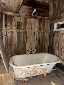 Downstairs, indoor/outdoor shower/bath area.