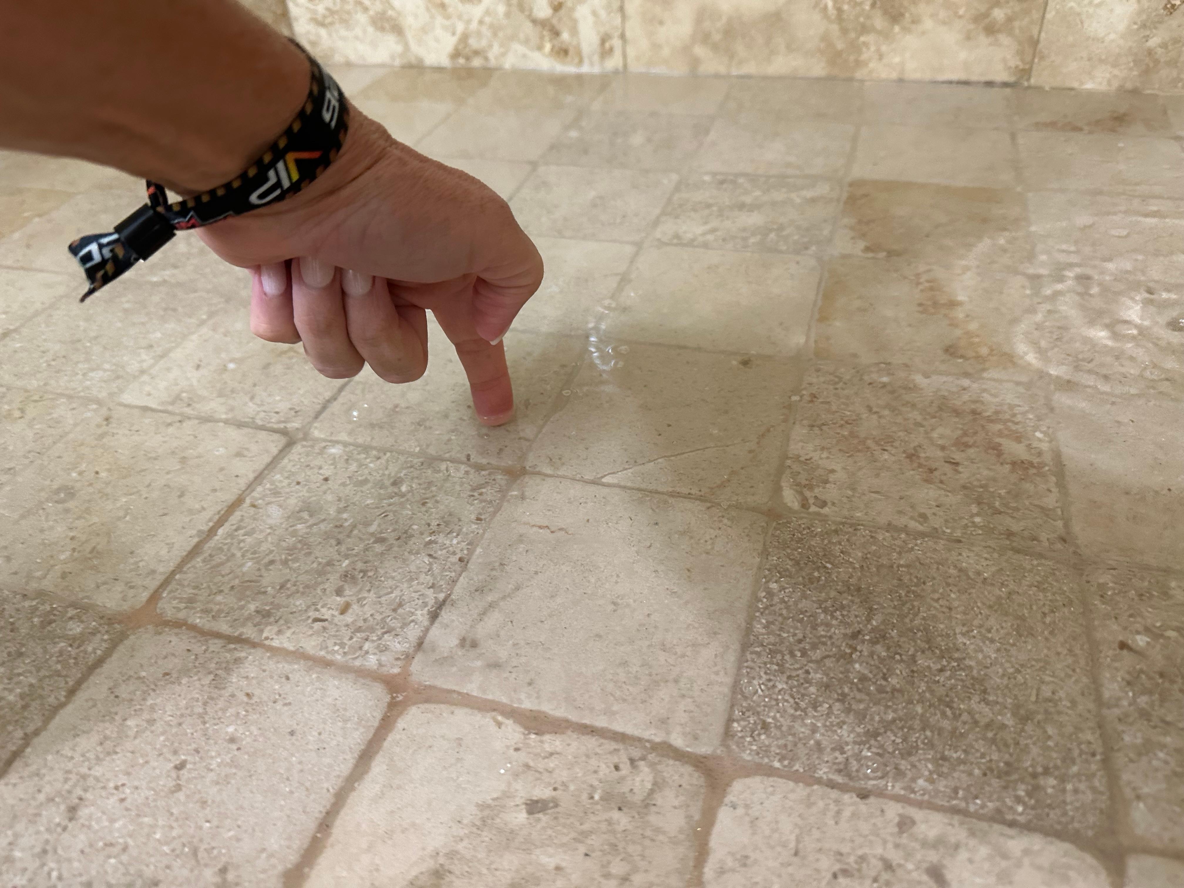 water pooling in shower
