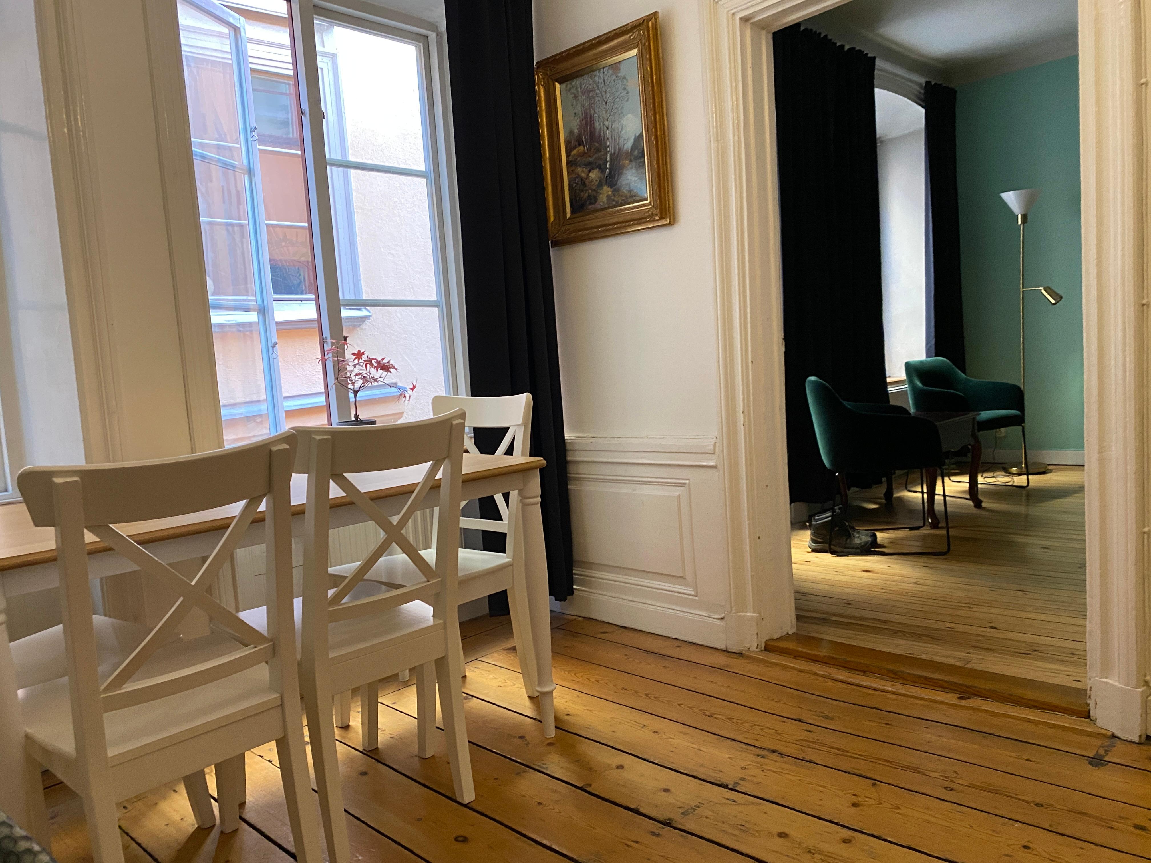 Sitting/dining area between kitchen and bedroom